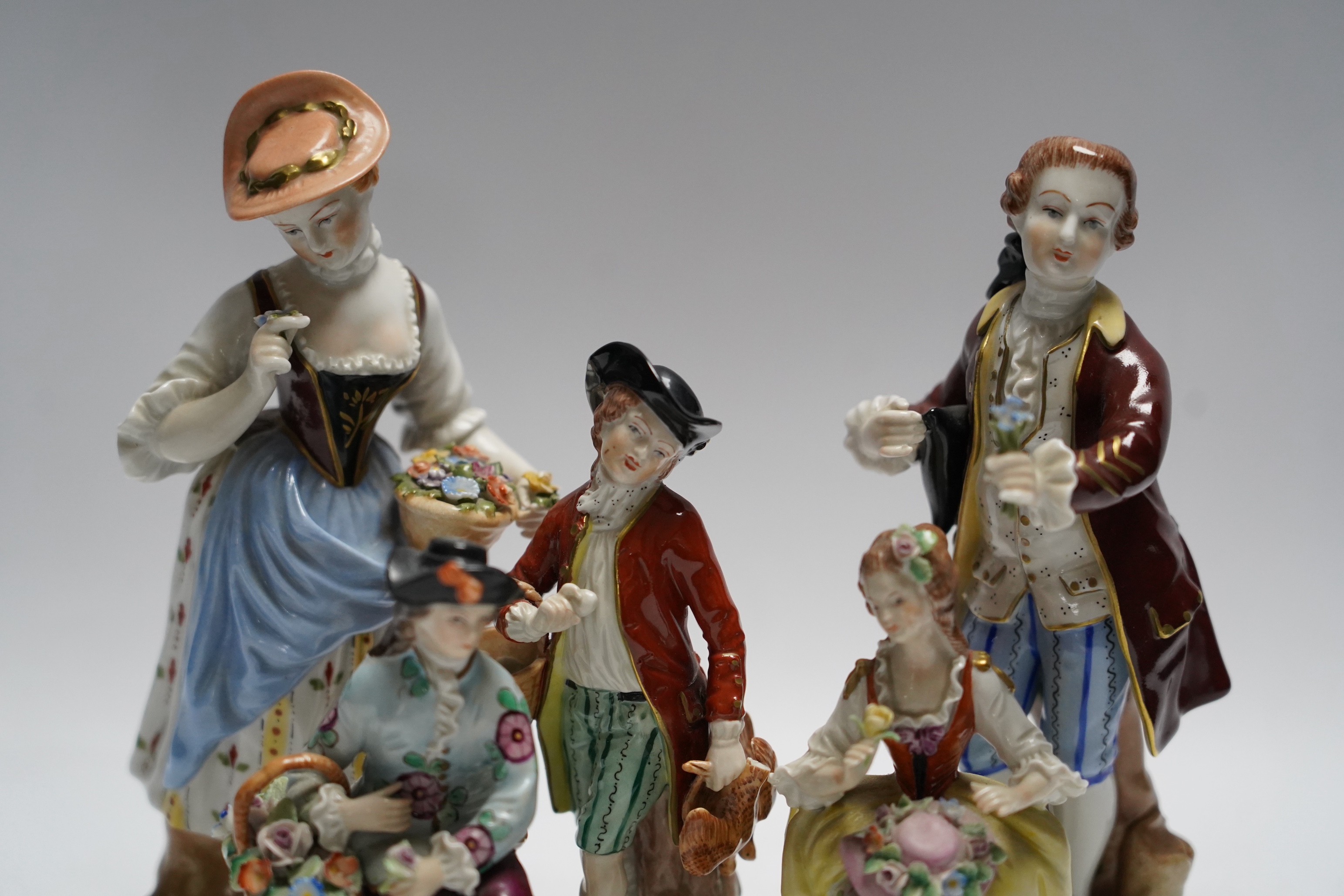 Three Dresden and two Sitzendorf porcelain figures, tallest 20cm
